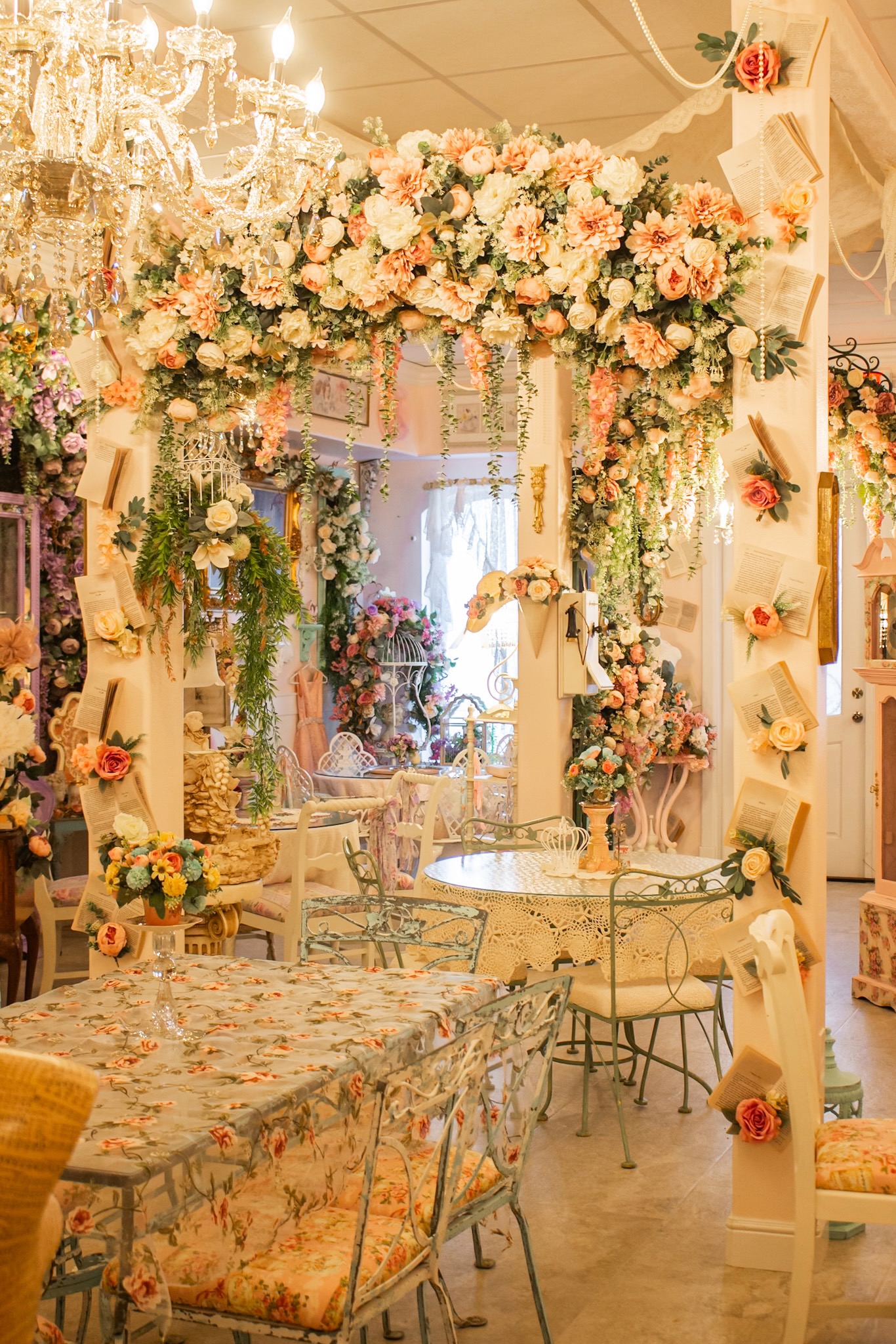 Event space set with tea tables and florals