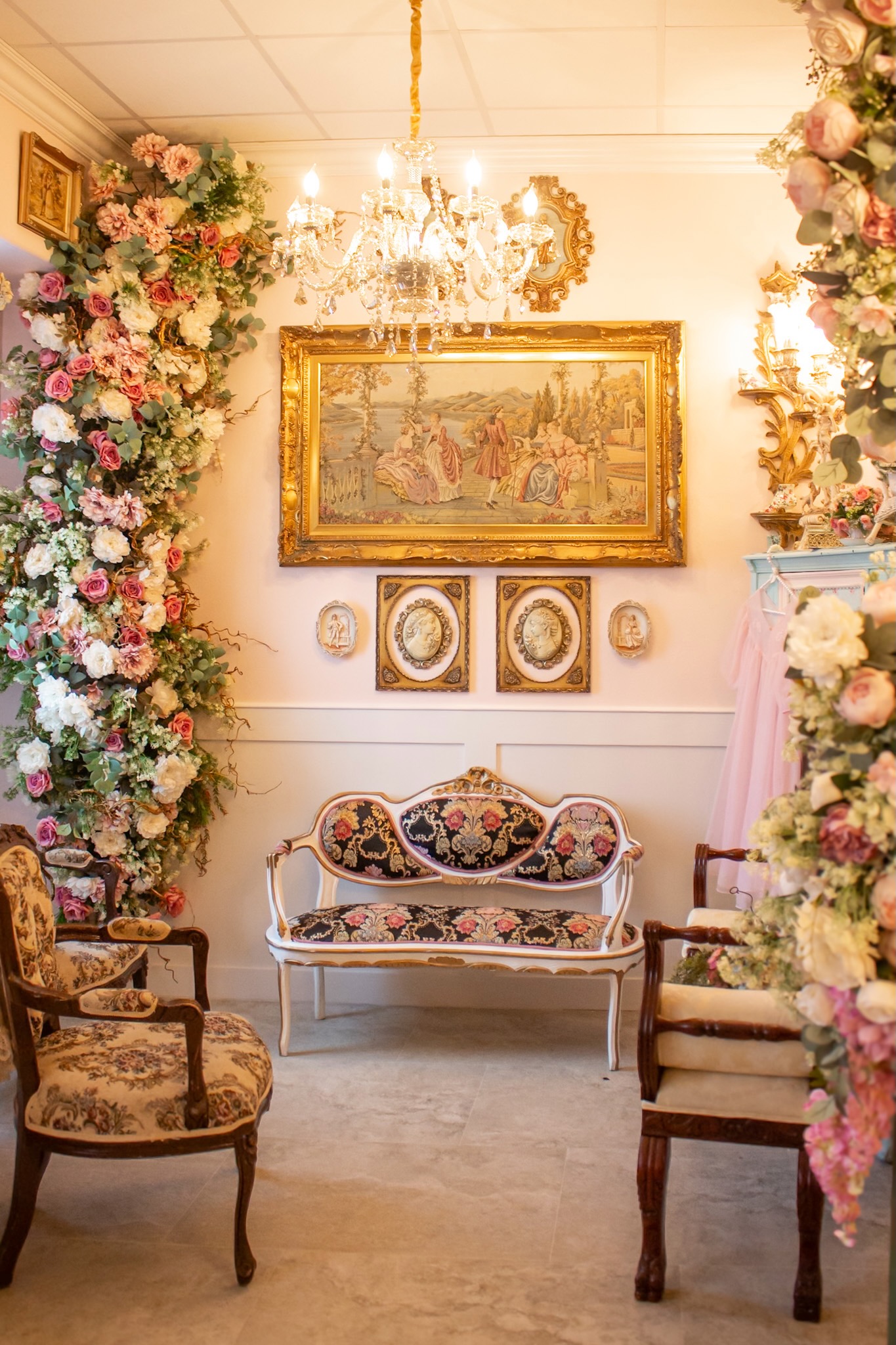 Gold gallery wall and loveseat