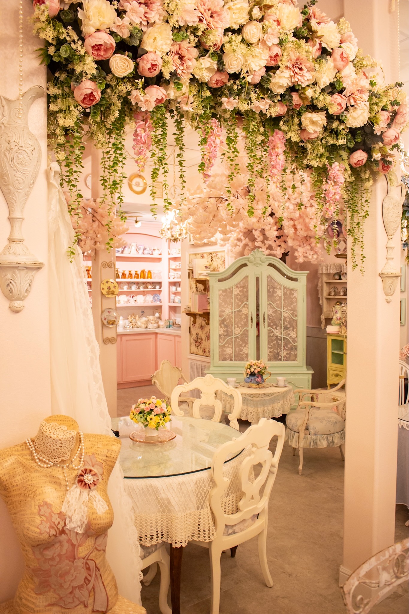 Floral canopy over tea tables